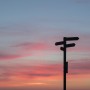 Signpost at sunset